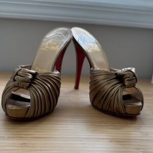 Christian Louboutin Metallic Gold Knotted Peep-Toe Mules with Red Soles